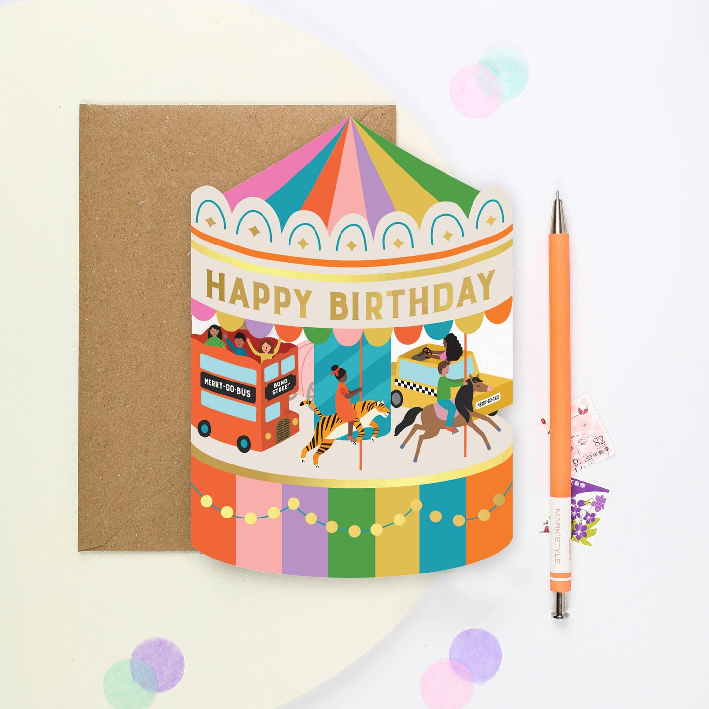 Carousel Adventure Shaped Birthday Card with gold foil 'Happy Birthday' text, featuring illustrations of a New York taxi, horse, tiger, and red London bus. Sustainably sourced, made in the UK.
