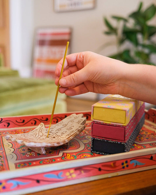 Close-up of natural lemongrass incense sticks in recycled packaging