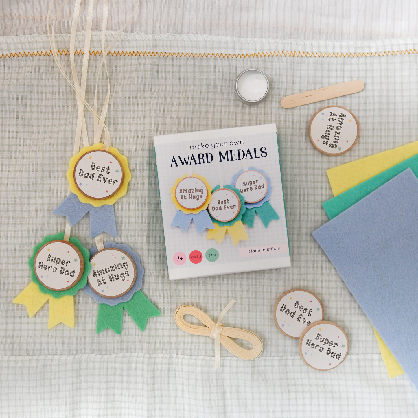 Craft Kit Make Your Own Medals for Dad. Make Dad three 'Best Dad' award medals for Father's Day. They're easy to make, and they're the perfect gift for your super Daddy.
The kids can make Dad a unique and personal Father's Day keepsake gift with this mini medals craft kit. It's completely plastic free and contains everything you need to make three medals, using wool felt and beech wood.
The 'awards' included in this craft kit are: • Super Hero Dad • Best Dad Ever • Amazing At Hugs