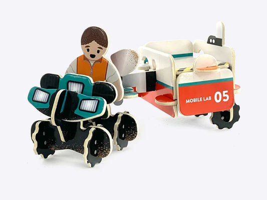 Close-up of children assembling the sustainably sourced Playboard dinosaur bones in the Natural History Museum Dino Dig Playset, highlighting the intricate details and eco-friendly materials.