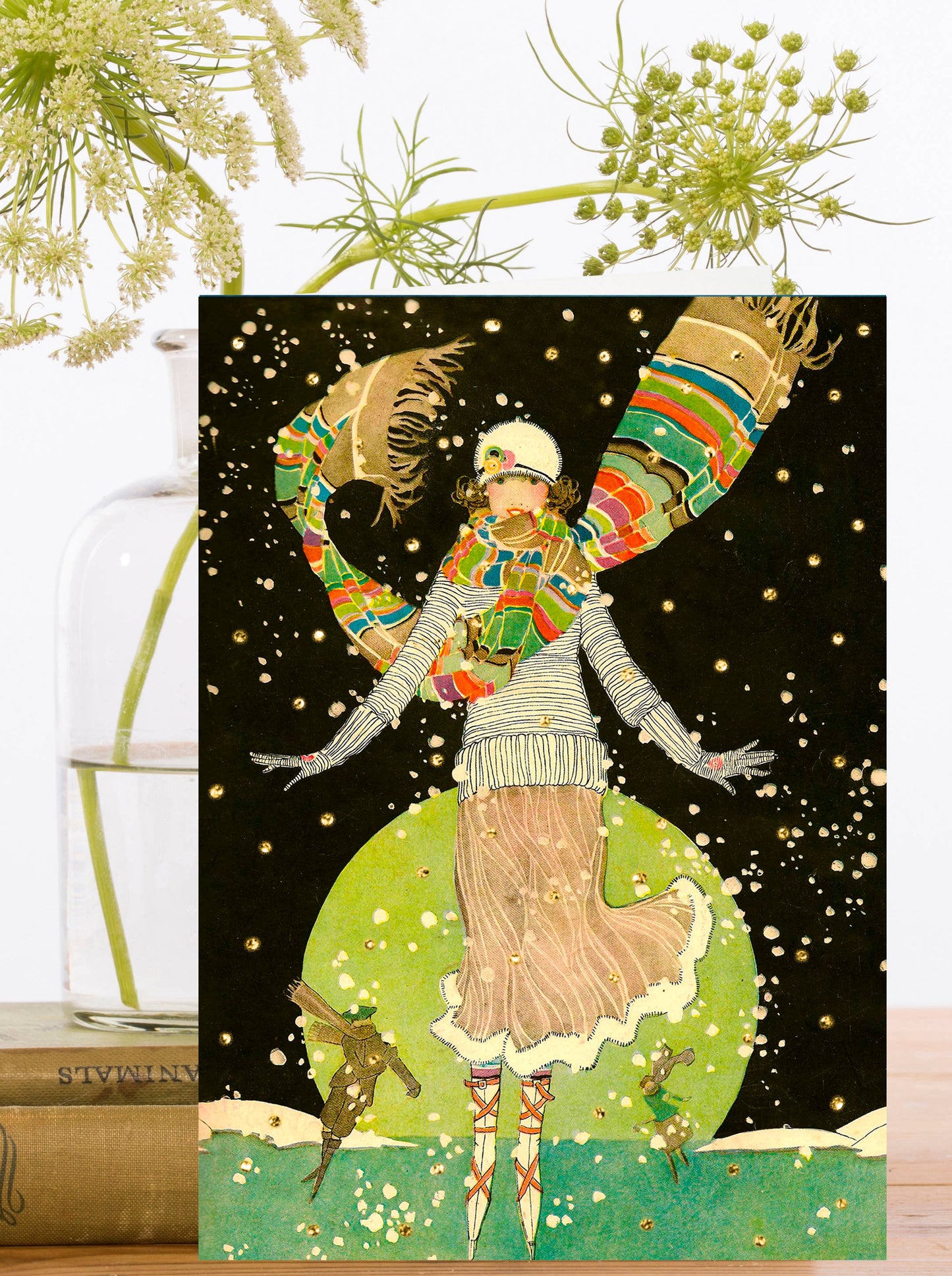 This vintage-inspired card from the 1930s showcases a sophisticated lady gliding gracefully on ice under the moonlight, surrounded by sparkling stars. She's dressed to impress, making for a truly elegant and enchanting scene. Christmas Card.