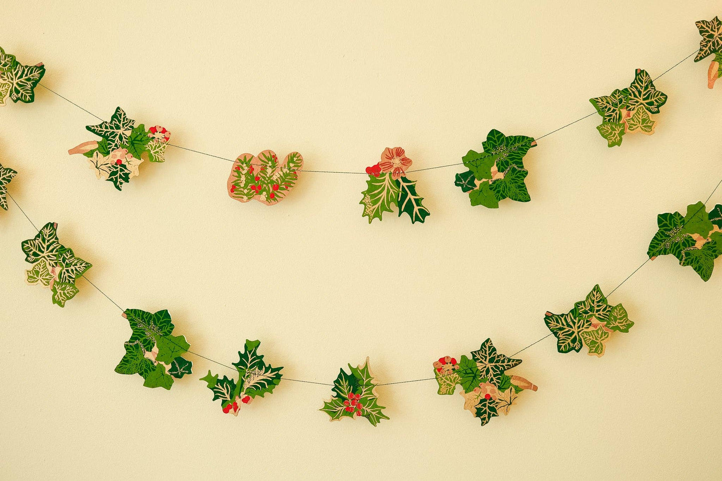 Hand screen printed Holly and Ivy Sewn Garland by East End Press on recycled paper with cotton thread