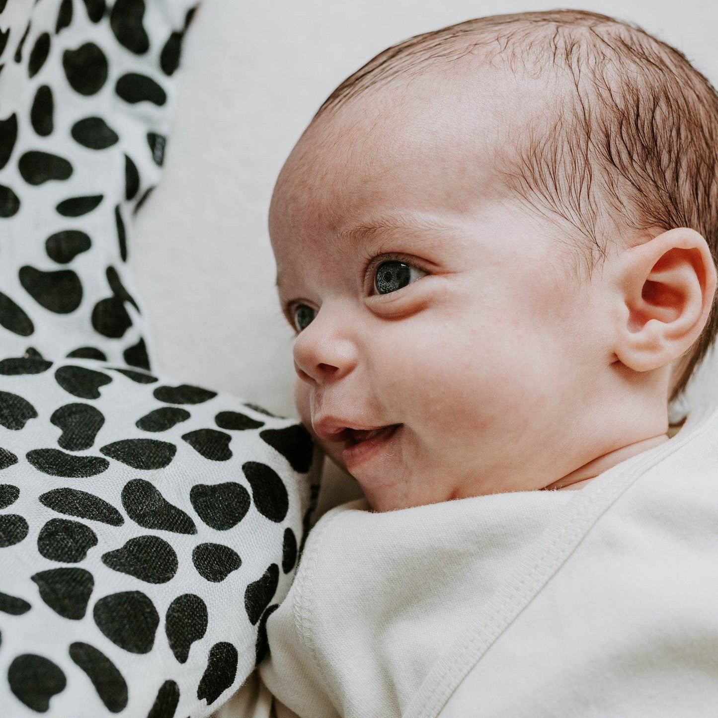 Set of three black and white sensory muslins by Etta Loves featuring zebra, starfish, and dalmatian patterns, made from GOTS-certified organic cotton, 60cm square each.
