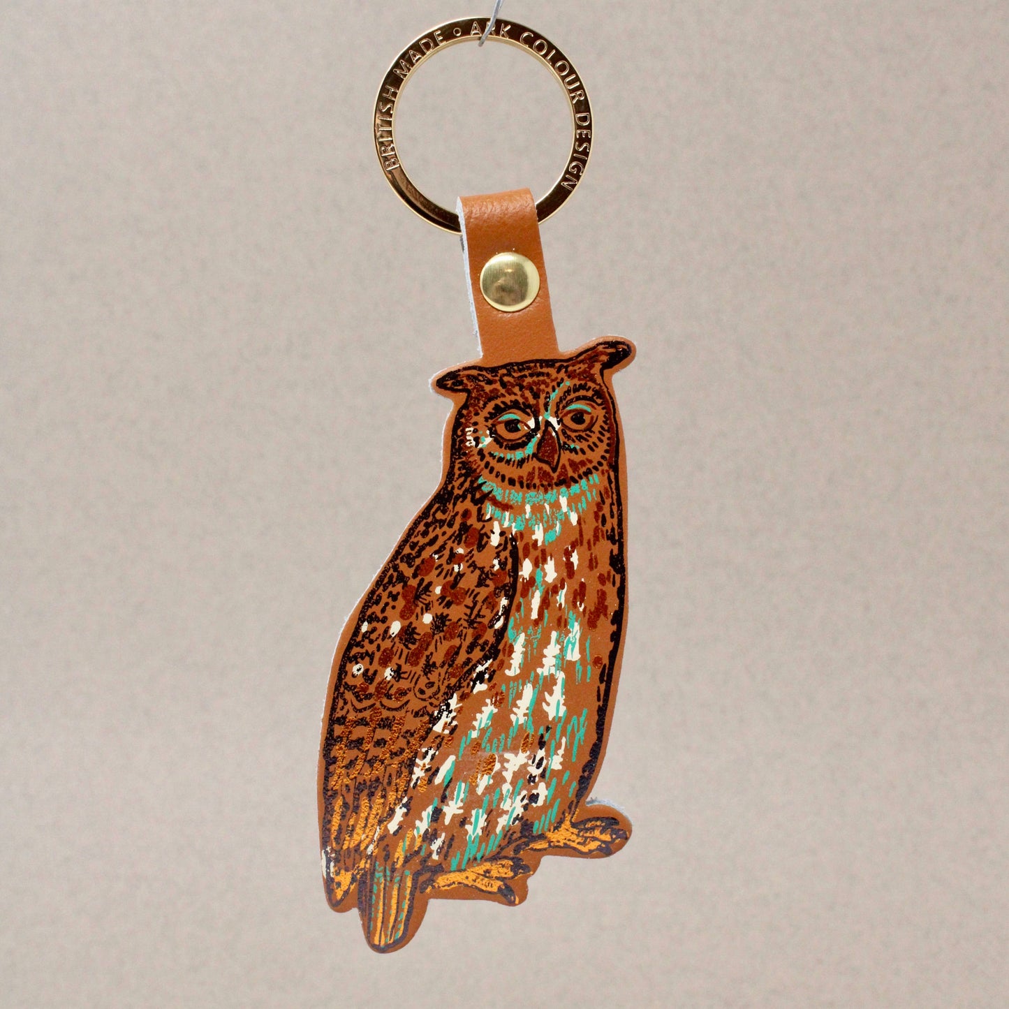 Nocturnal owl leather key fob handmade in Scotland, with gold-plated ring and hot foil embossed design by Ark Colour Design