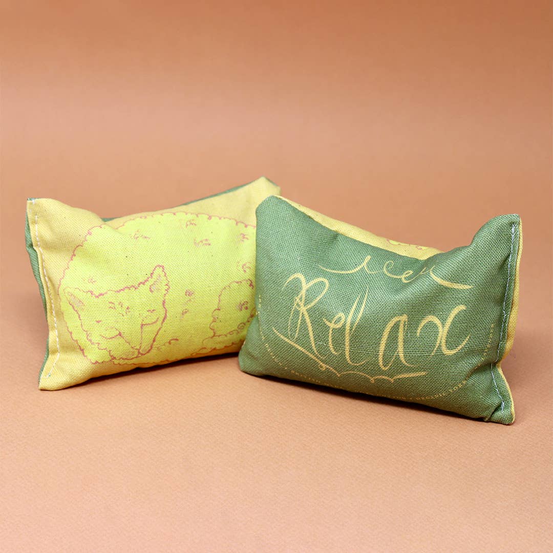 Yellow sleeping cat lavender bag made with organic cotton, illustrated and filled with calming lavender.