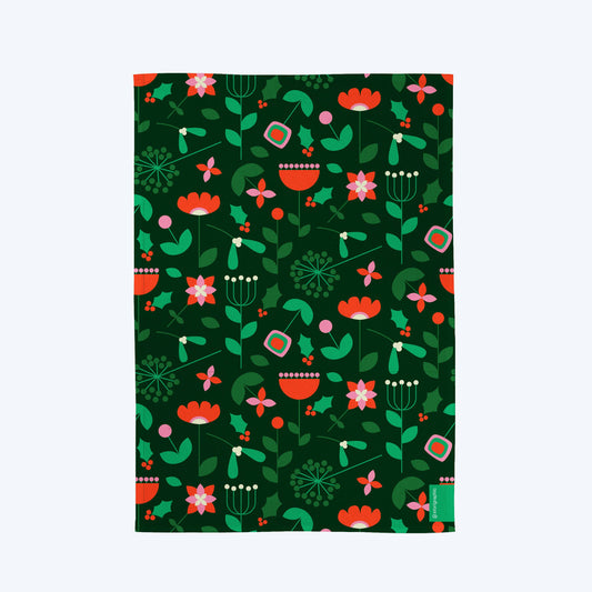 Close-up of Festive Bloom Christmas tea towel showcasing vibrant mid-century floral pattern on sustainable cotton.