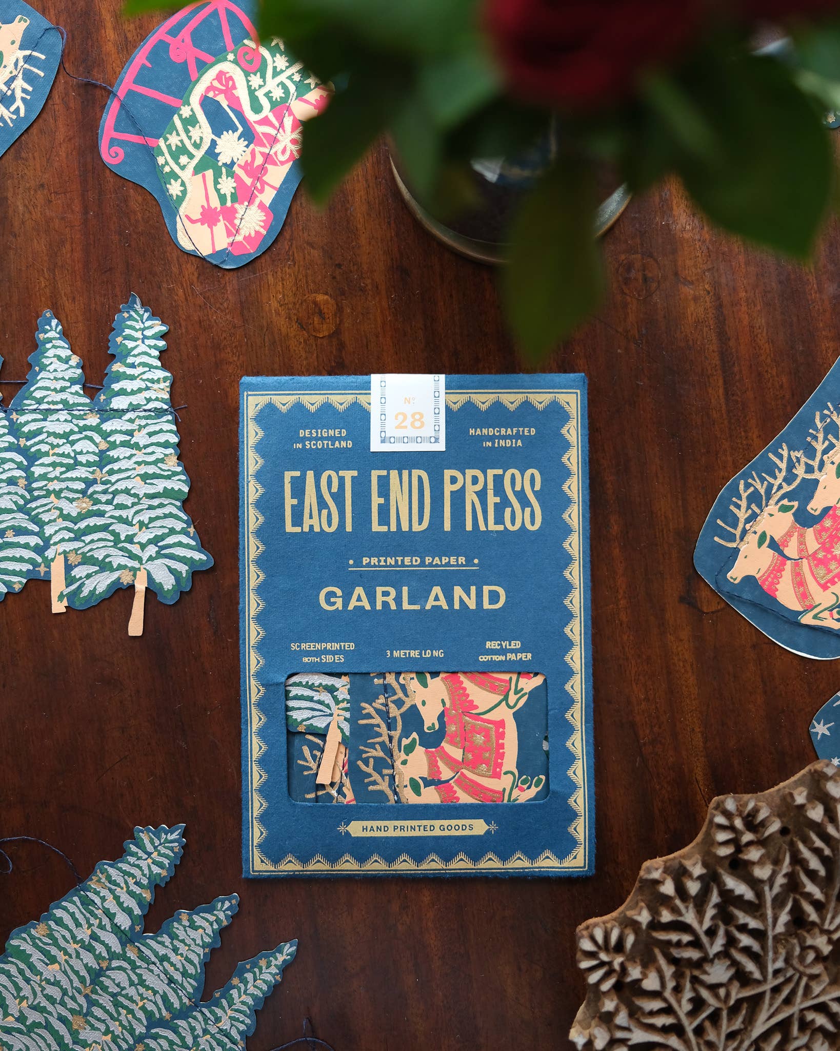 Screen printed Skyline Sewn Garland by East End Press with festive night time skyline images on recycled paper