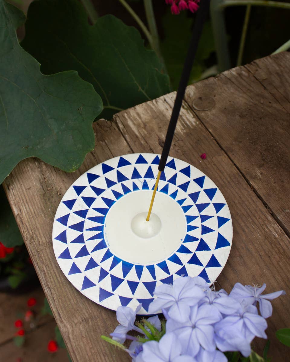Round soapstone incense holder with hand painted blue geometric design, crafted in Kisii, Kenya from sustainable stone and finished with beeswax.