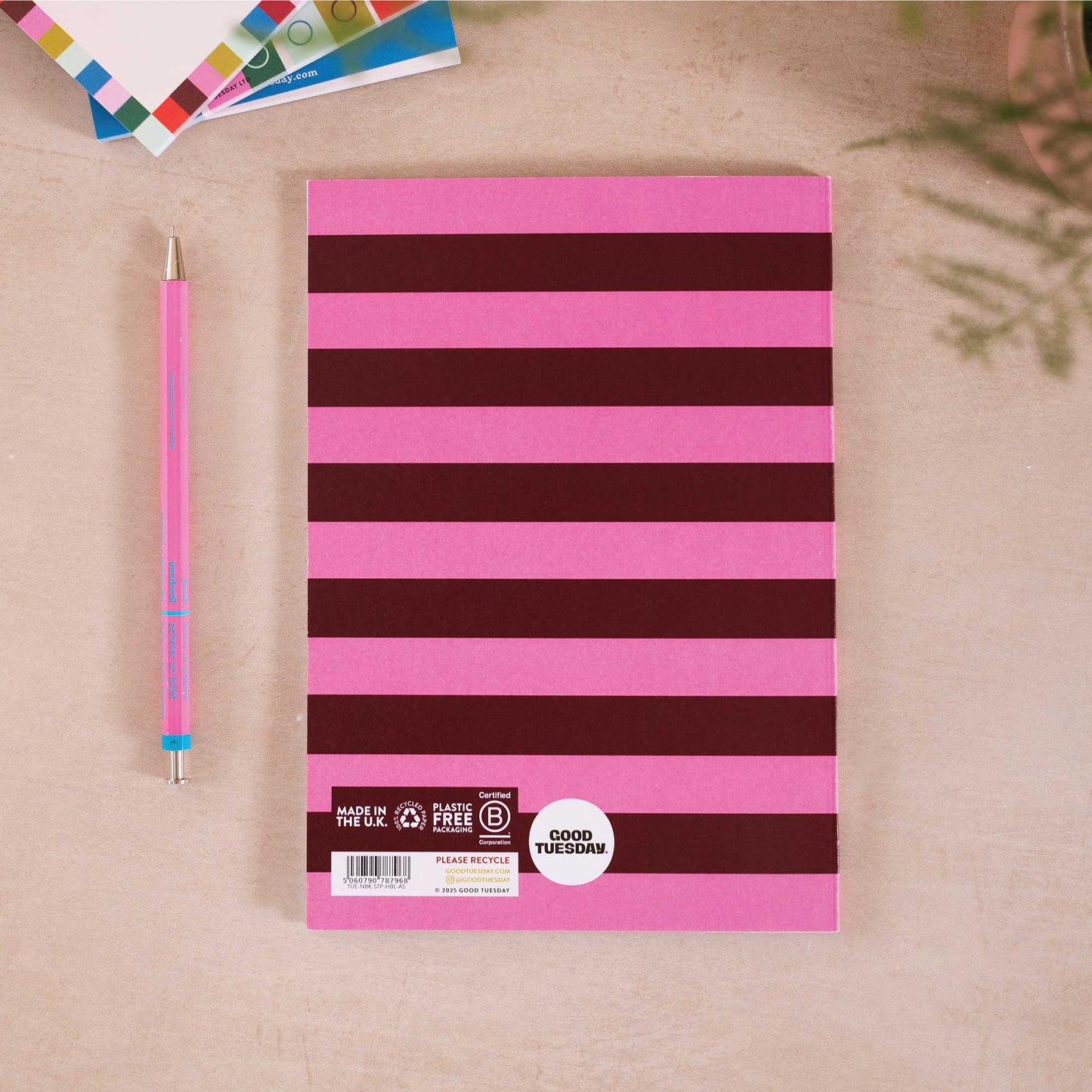 A5 Hot Pink Bloom Notebook with vibrant floral cover in hot pink and burgundy, minimalist bellyband, 60 recycled lined pages, UK made.