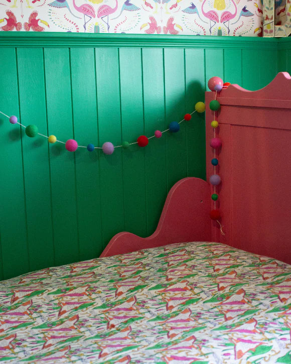 Rainbow pompom decorative garland. Hang this handmade garland on walls or doorways for a colourful party decoration.
This fun pompom garland is a great gift for those who value ethical and handmade décor, and the preservation of cultures. The felt used to craft this garland was made from the finest material: 100% pure New Zealand wool, making it non-allergic and non-toxic.