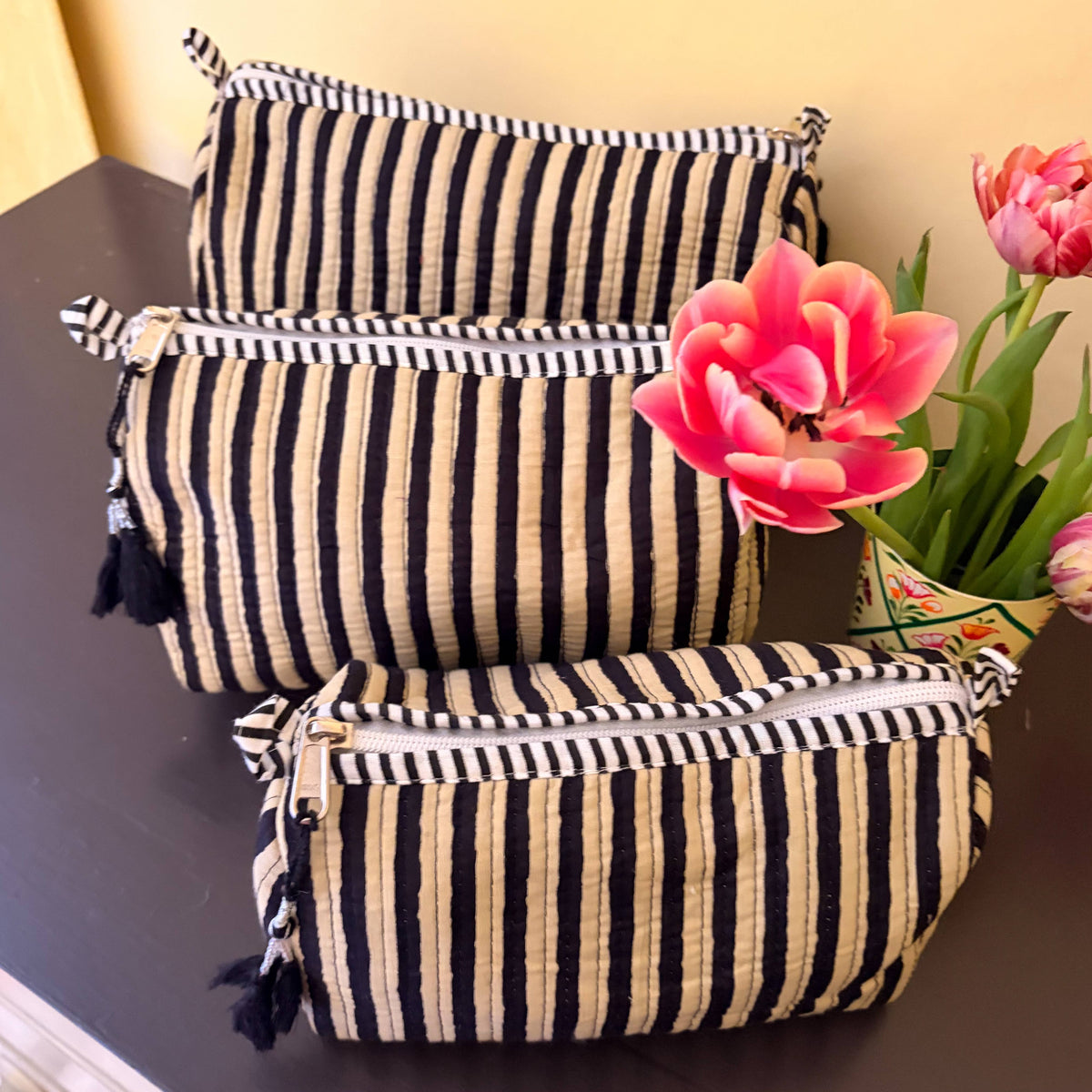 Handmade striped makeup bag in small, medium, and large sizes