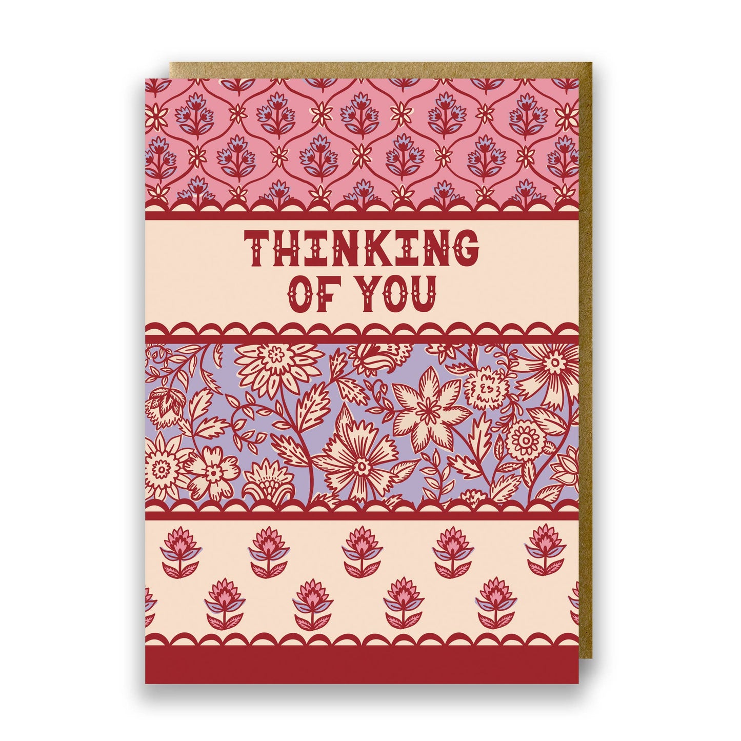 Hand drawn lettering reads 'Thinking of you'. Illustrated greeting card with Indian block print inspired floral pattern, printed onto premium matt card with a kraft envelope.