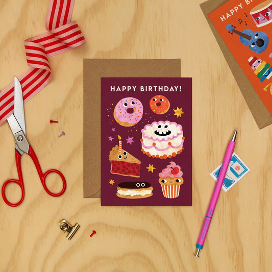 Birthday card with cartoon food illustrations by Emily Nash. Made in the UK.