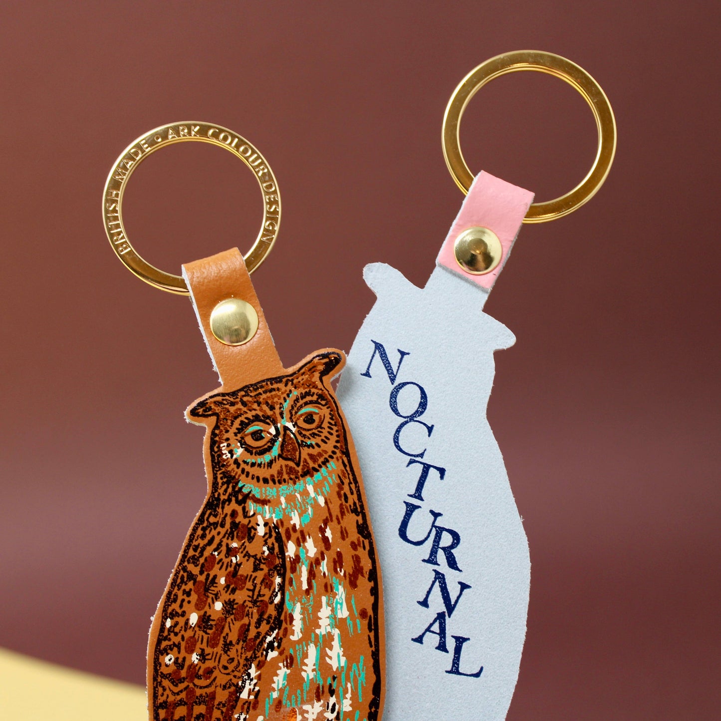 Nocturnal owl leather key fob handmade in Scotland, with gold-plated ring and hot foil embossed design by Ark Colour Design