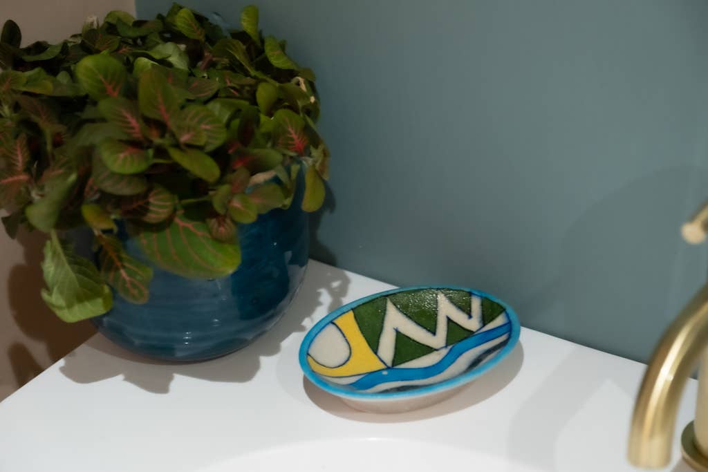 Handpainted ceramic soap dish with drainage holes, made in Jaipur using natural clay alternatives and traditional pottery methods, unique and colourful bathroom decor.