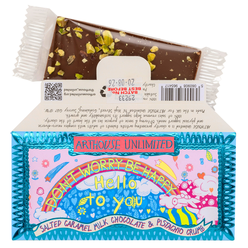 Joy Sized: Be Happy salted caramel milk chocolate bar with pistachio crumb, wrapped in recyclable paper featuring Jack Churchyard’s artwork.