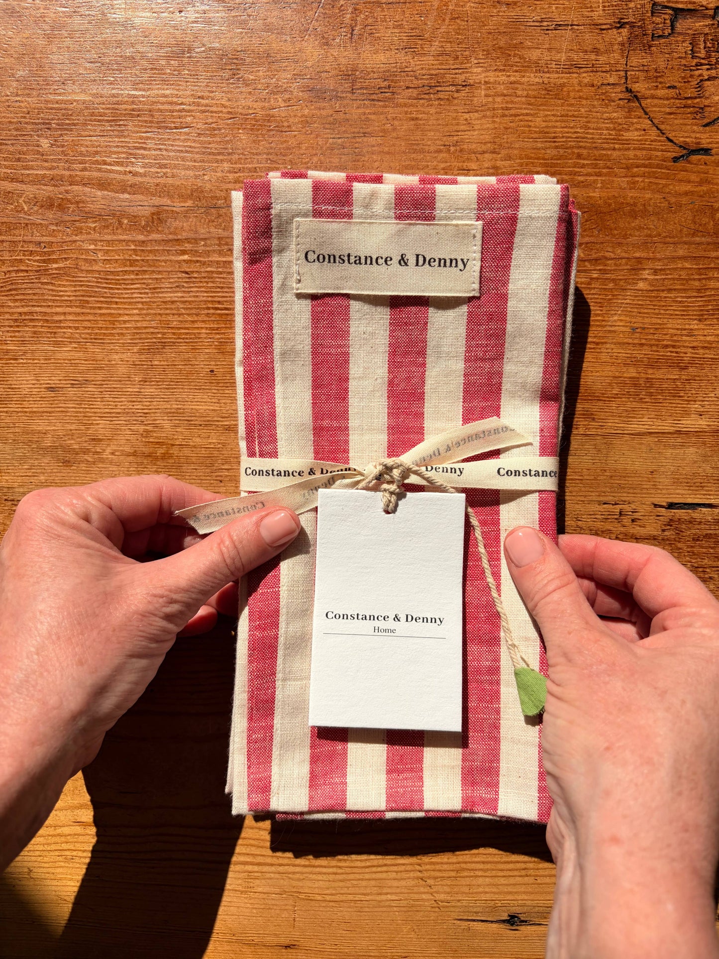 Set of 4 poppy stripe woven cotton napkins styled with ceramics