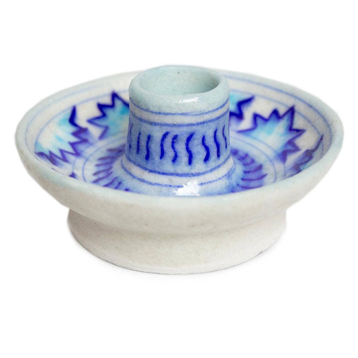 Discover our eco-friendly ceramic candle stick holder, a stunning addition to your sustainable gift collection. Handmade in India, this unique piece showcases a joyful white base adorned with a pale and royal blue pattern, perfect for elevating any dining table or living room decor. By choosing this environmentally responsible present, you support artisans and promote green gifting practices. Brighten your space while making a positive impact—opt for our sustainable gift cards and gifts today!
