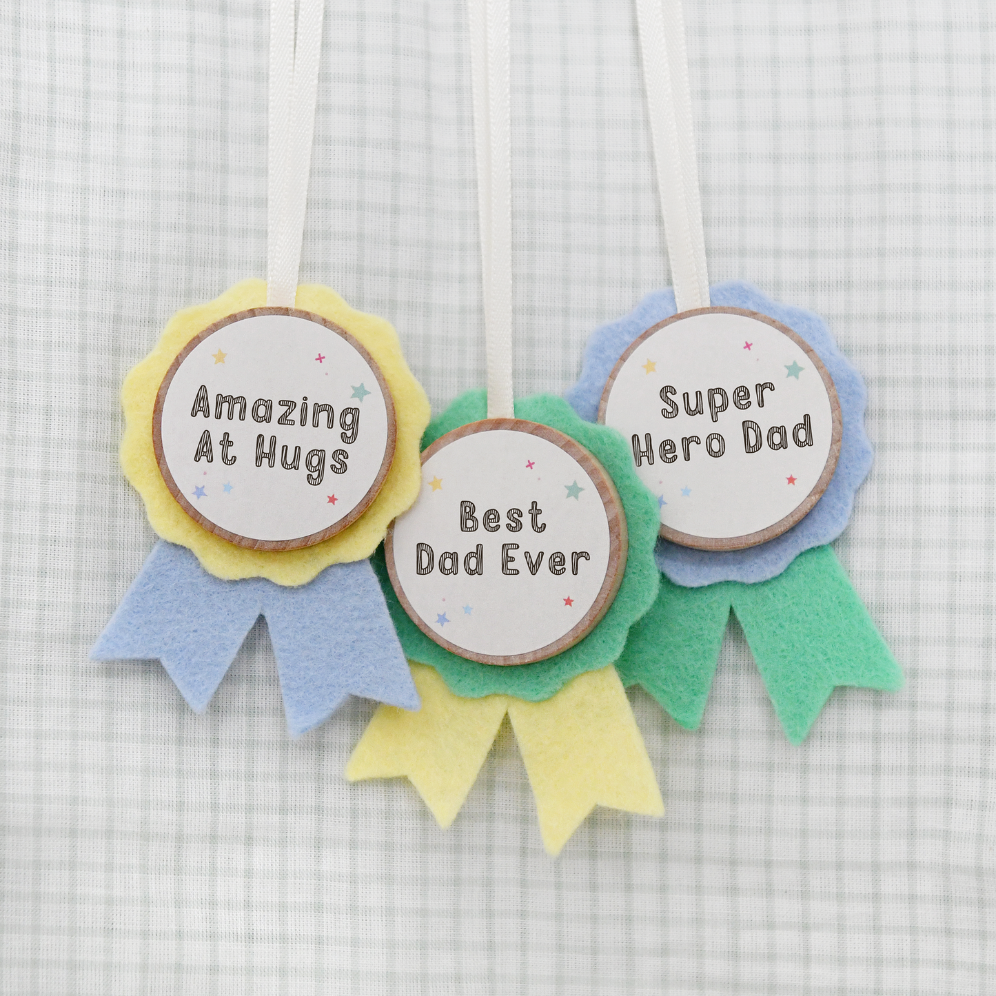 Amazing at Hugs, Best Dad Ever and Super Hero Dad medals. Craft kit to make them for Father's Day.