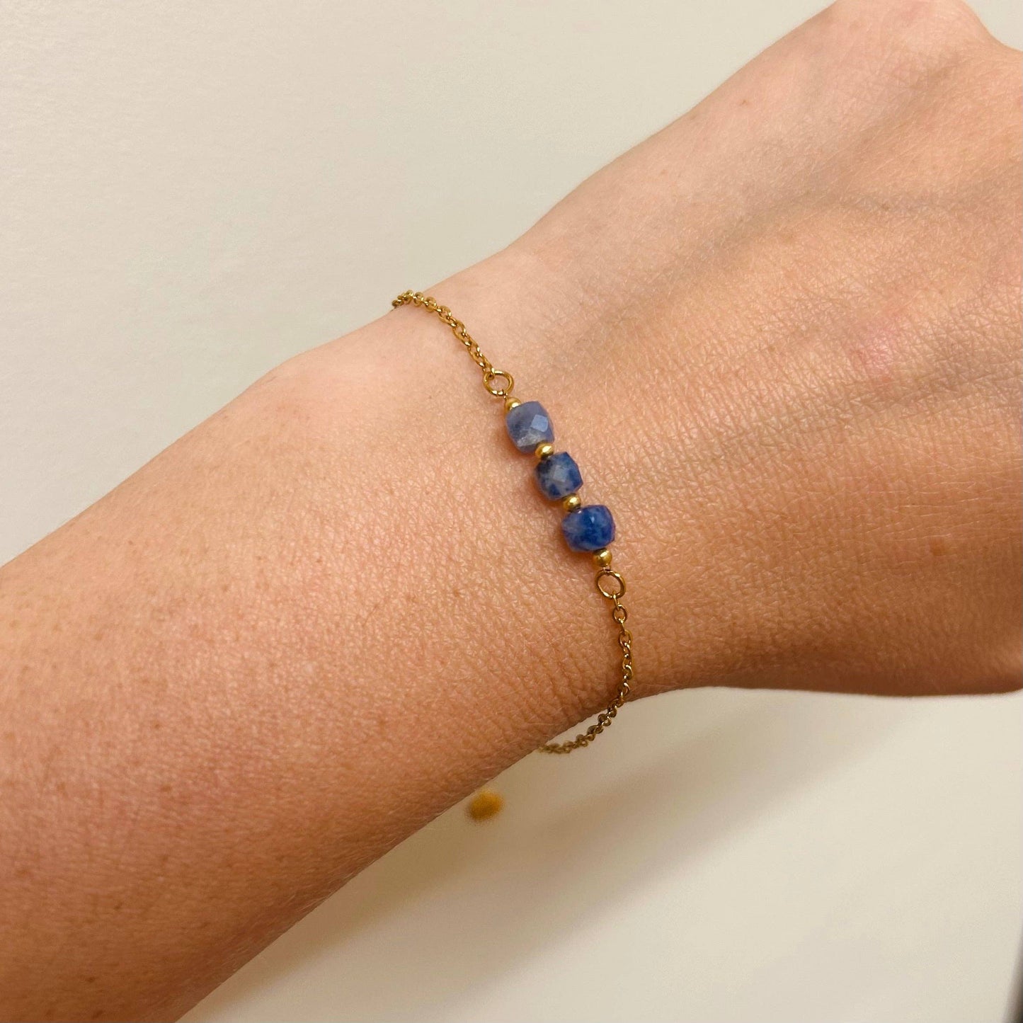 Little Nell lapis trio bead bracelet, gold-plated, waterproof, adjustable chain, and celestial blue lapis lazuli beads