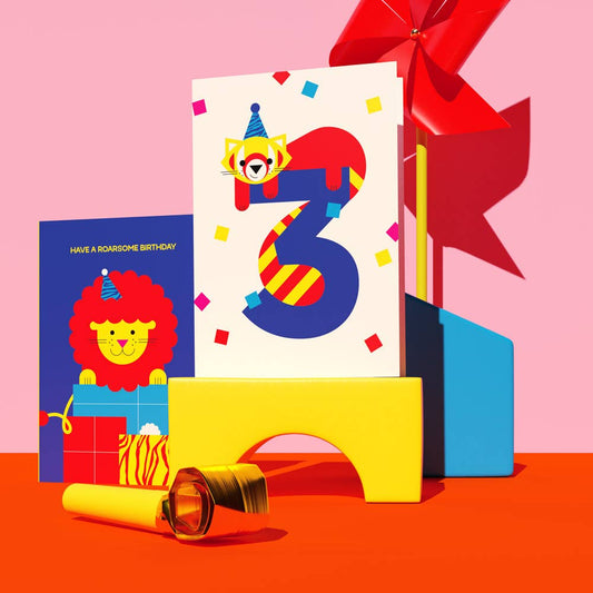 Close-up of cute bear holding balloon illustration on sustainable birthday card