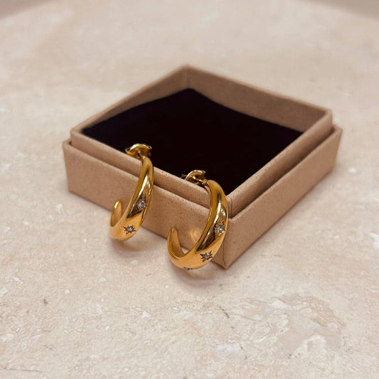 Pair of Star Embossed 18k Gold Plated Hoops displayed on a white background