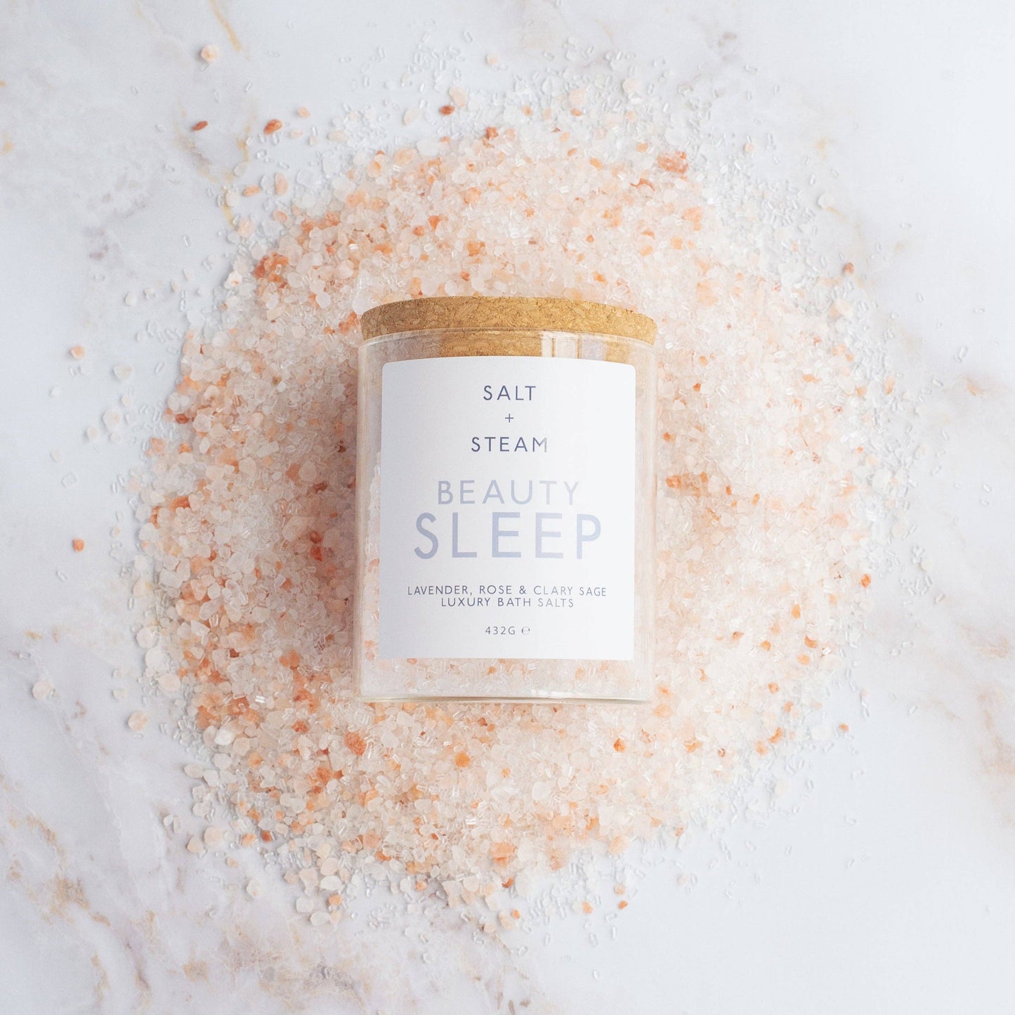 Beauty Sleep Lavender Rose and Clary Sage bath salts in glass jar.