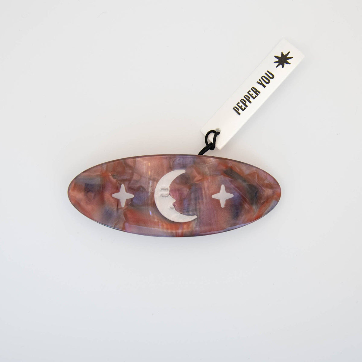 Lifestyle shot of Night Sky French barrette clipped into hair