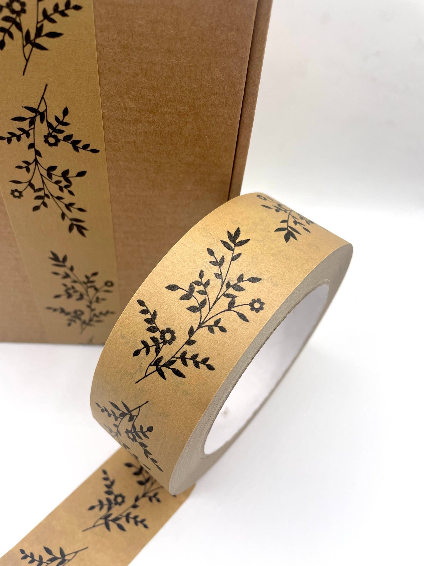 Stack of multiple rolls of Wildflower Kraft Paper Tape
