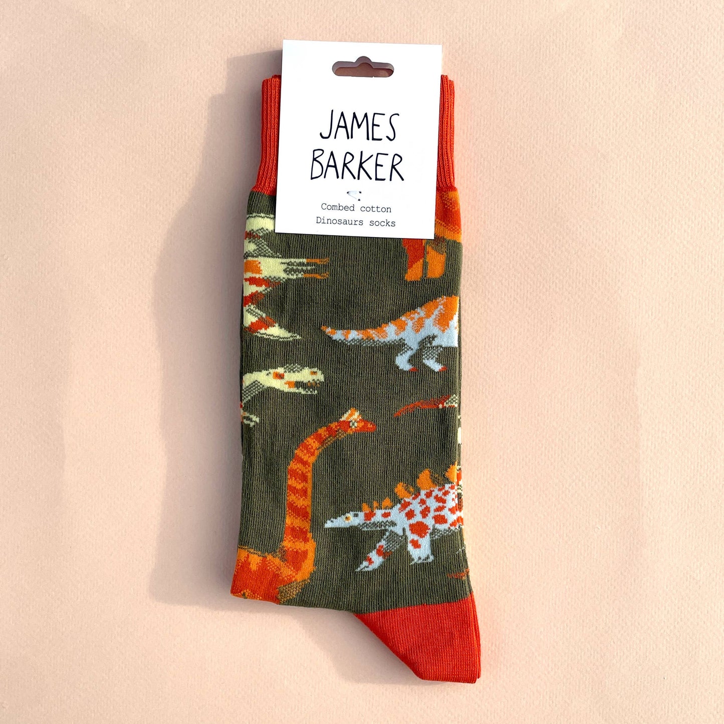 Colourful hand-illustrated dinosaur cotton socks by James Barker—fun, vibrant, and perfect for dinosaur lovers and collectors.