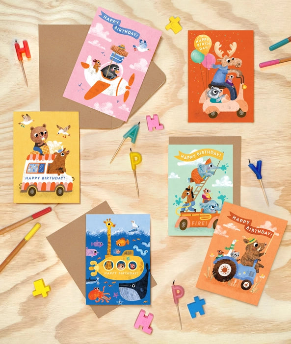 Join the birthday bash with this multipack featuring vibrant animal illustrations, cruising to the celebration in style!
Pack of 6 Illustrated greeting card by Emily Nash Illustration, presented in a cardboard box.