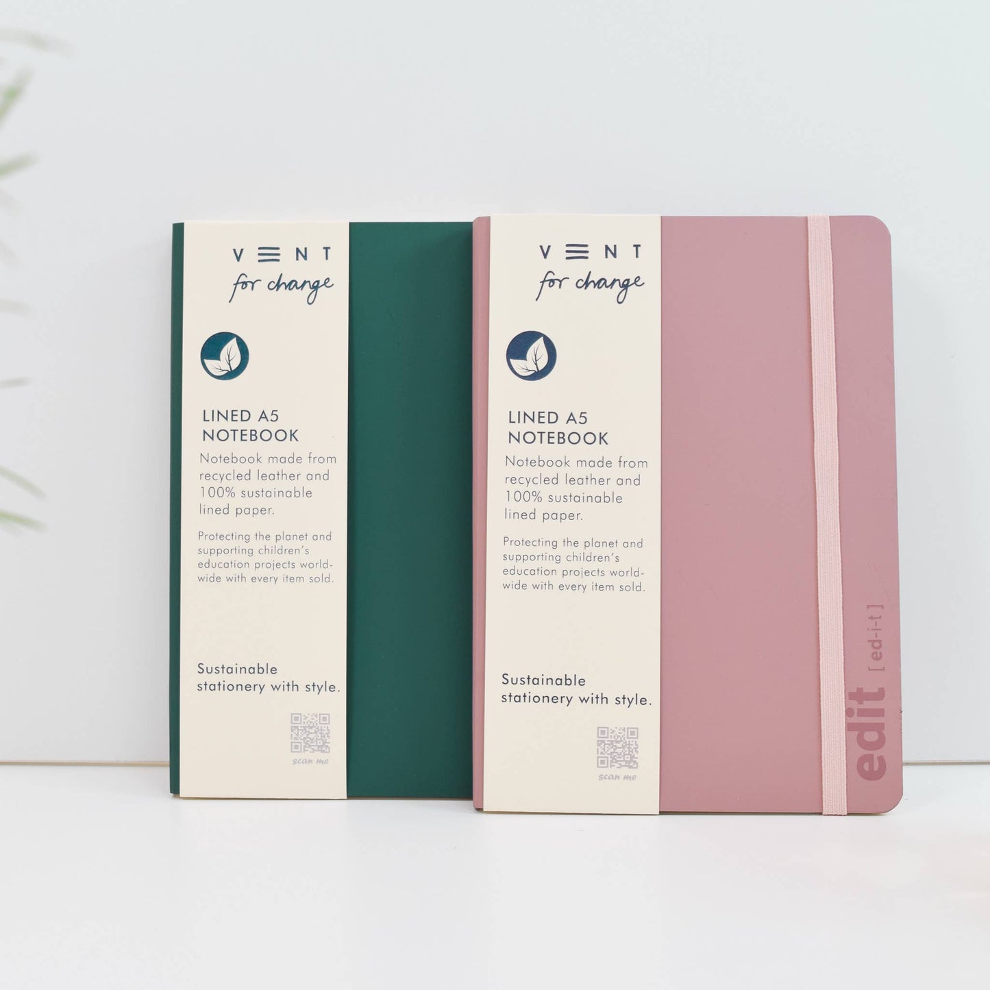 Close-up of ETHOS icon debossed on Emerald Green Recycled Leather Notebook cover