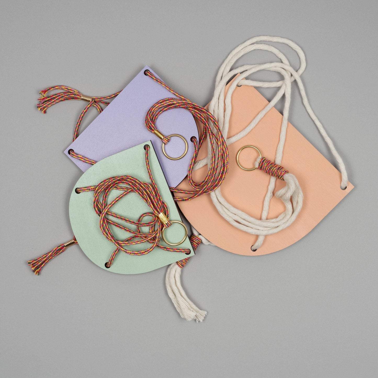Various colours and sizes of Studio Wald plant shelves are shown.