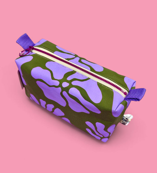 Lilac and green floral handprinted boxy pouch made from dry-wax cotton canvas, fully lined with contrasting fabric.