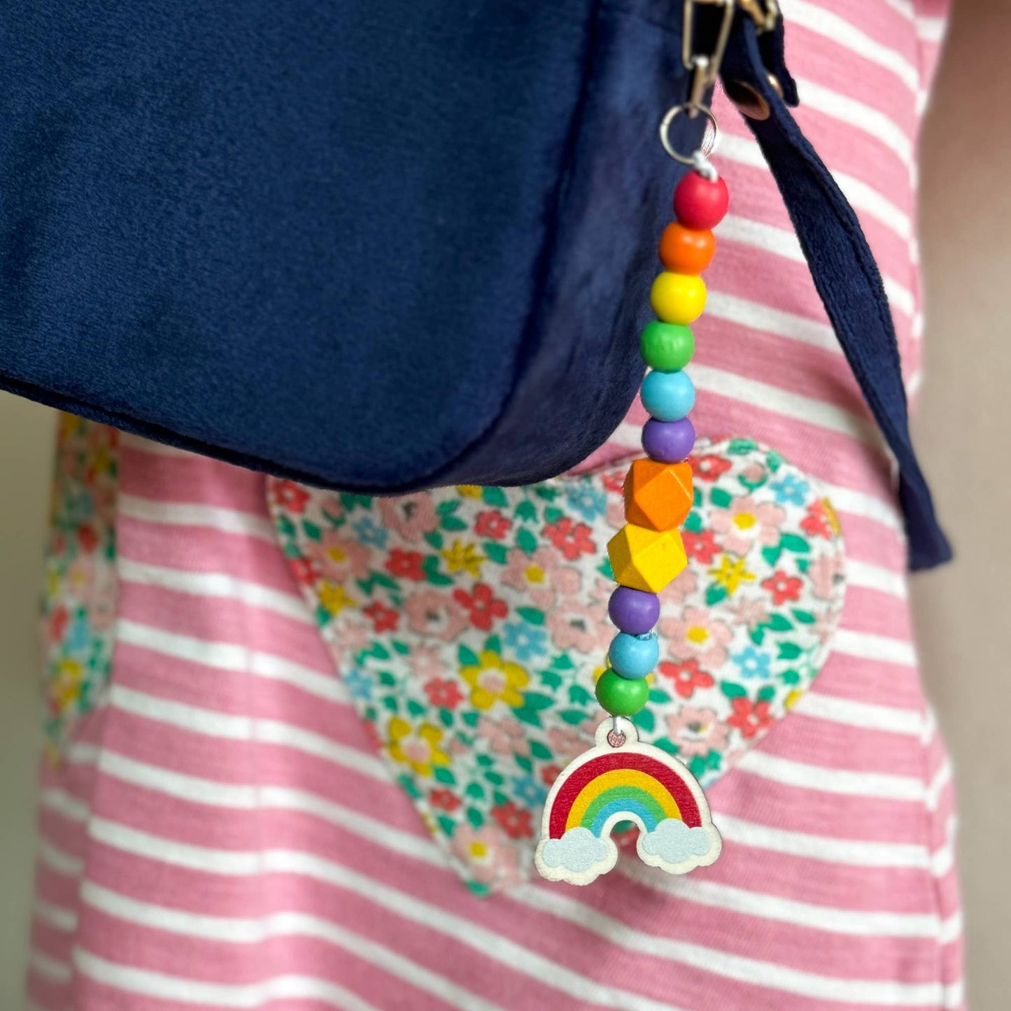 The Lucky Dip Keyring hanging from a kids rucksack