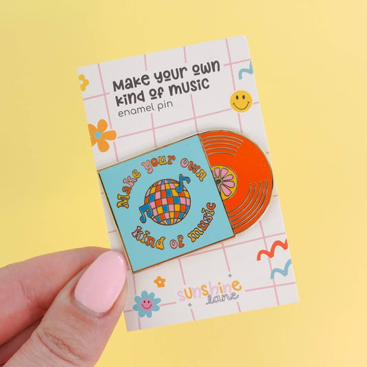 Retro vinyl record and disco ball enamel pin with ‘Make Your Own Kind of Music’ quote, gold hard enamel