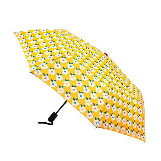 Compact floral umbrella showing automatic open mechanism