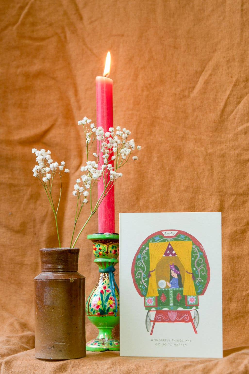 Detailed view of 'Gypsy Wagon' good luck card with recycled kraft envelope