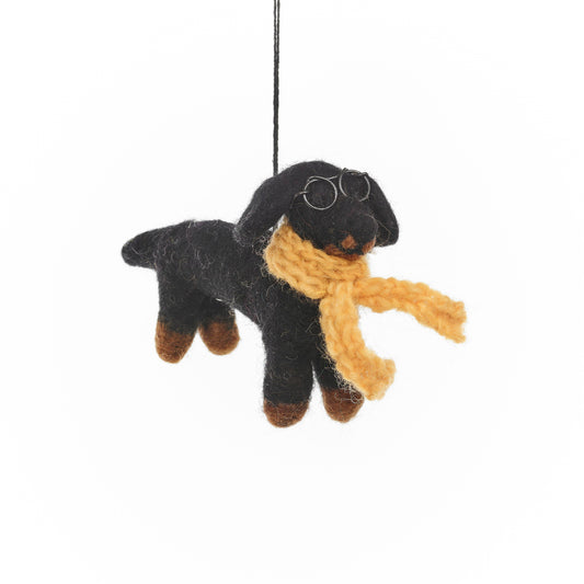 Close-up of handmade felt Douglas Dachshund decoration, showing detailed knitted scarf and wire glasses.