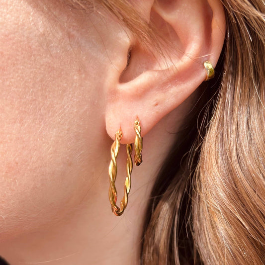 Close up of 18mm twisted gold hoop earring