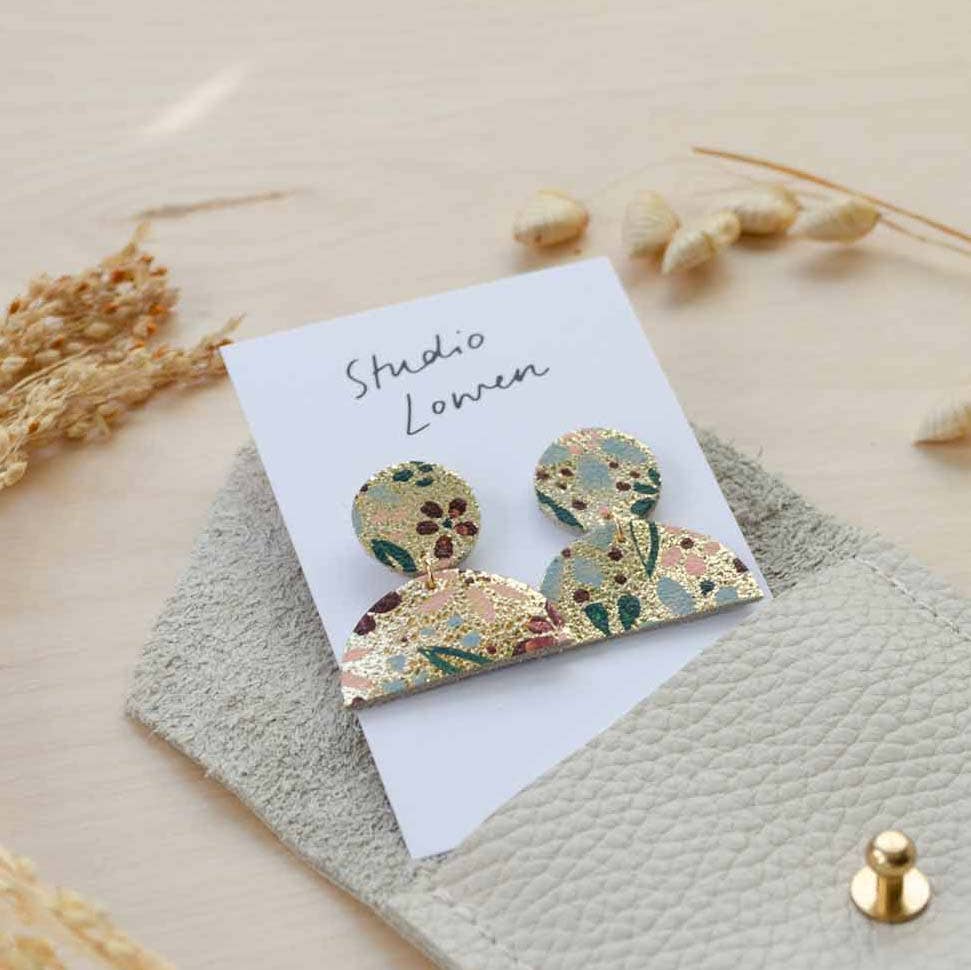 Hand-painted floral drop leather earring showcasing lightweight design