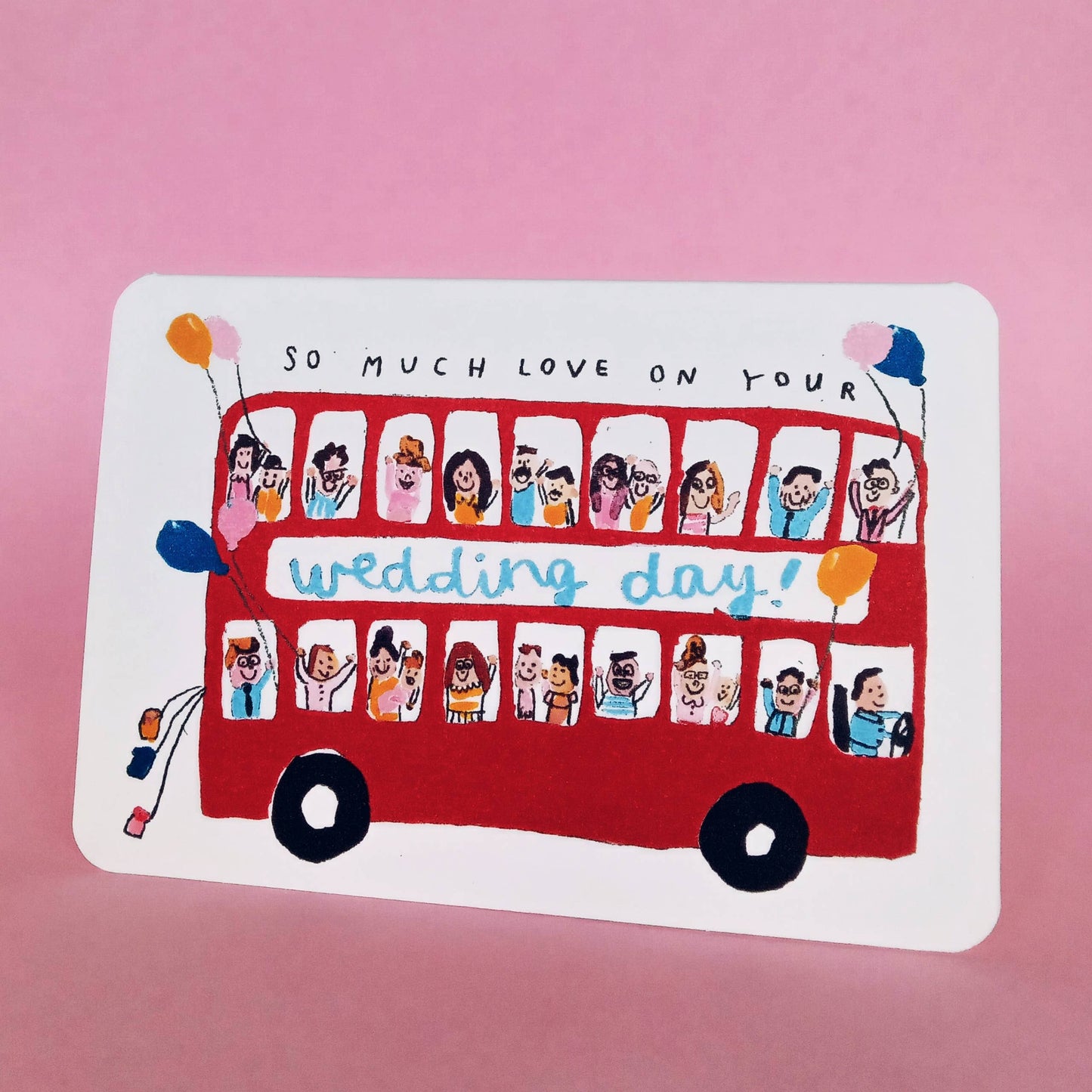 Handmade recycled wedding bus card with red double-decker bus design, eco-friendly packaging