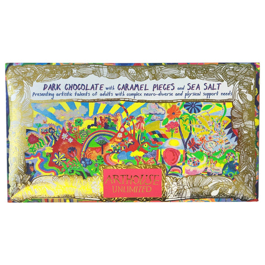 Joy Revolution dark chocolate bar with caramel pieces and sea salt, wrapped in coloured foil with original Arthouse Unlimited artwork in gold frame.