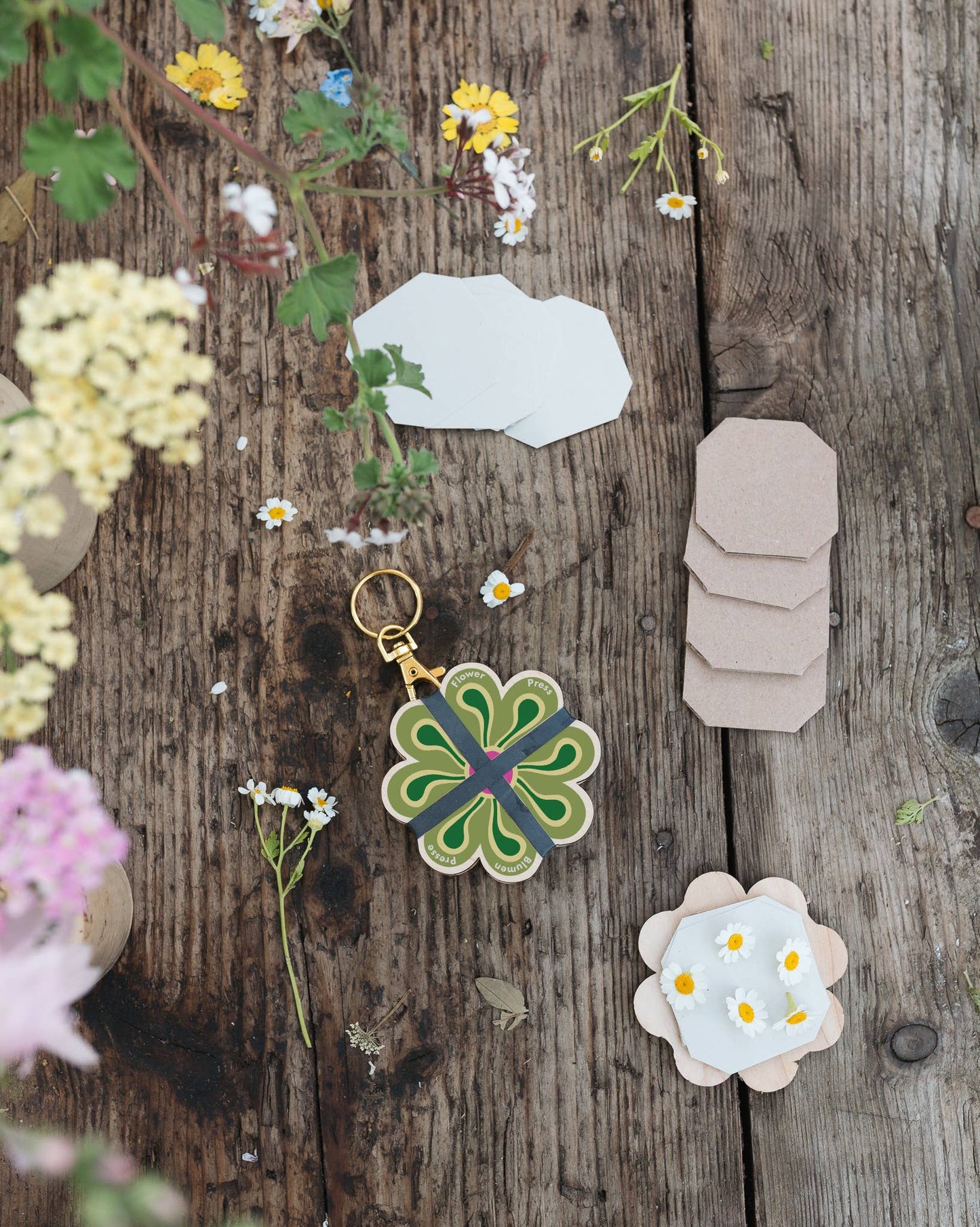 Collection of keyring flower presses in various colours