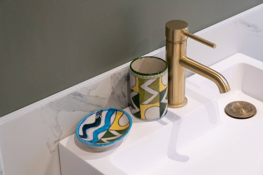 Handpainted ceramic soap dish with drainage holes, made in Jaipur using natural clay alternatives and traditional pottery methods, unique and colourful bathroom decor.