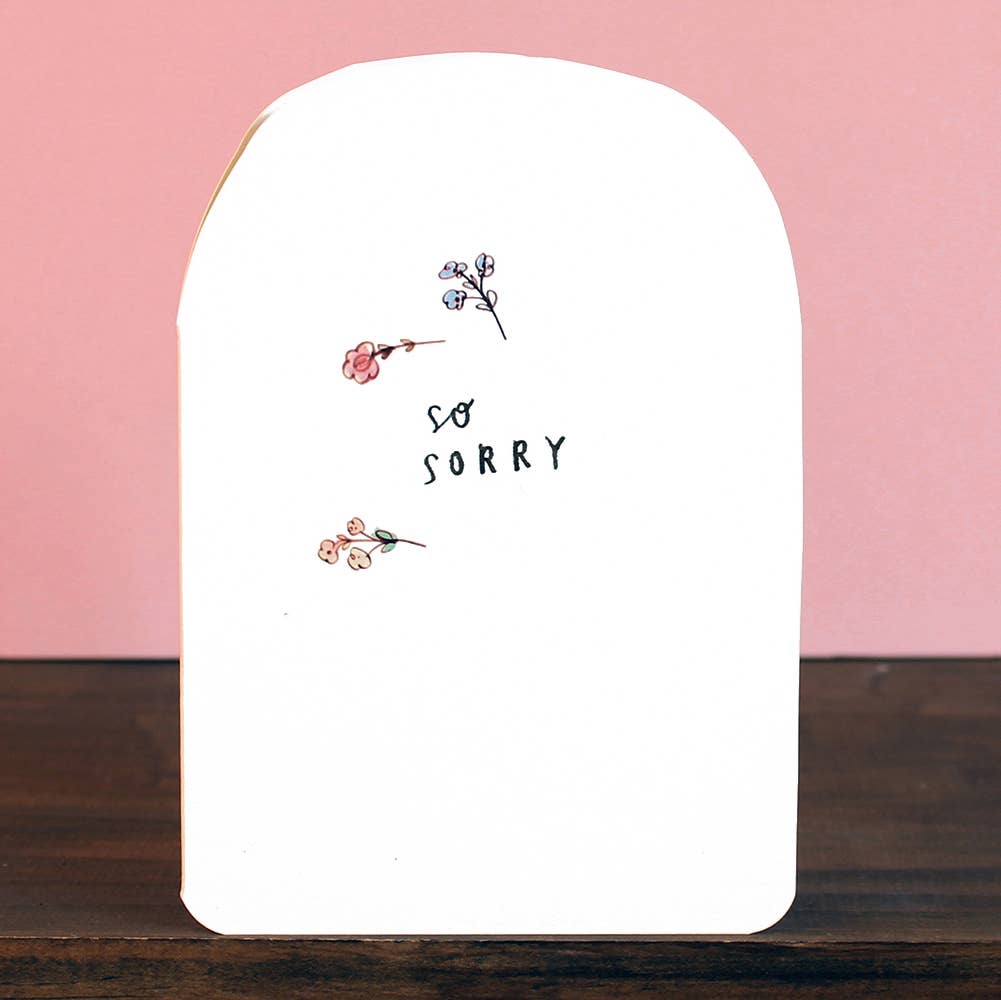 Handmade 'So Sorry' sympathy card with delicate floral illustrations on recycled card, packaged in biodegradable sleeve.