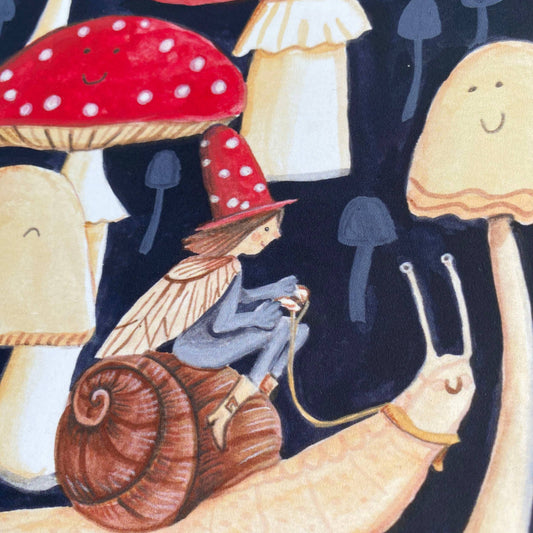 Detail of the charming elf and snail illustration on a sustainably sourced greetings card