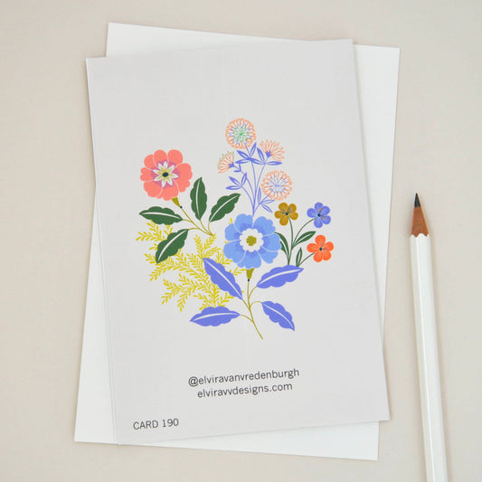 Close-up of 'Sending Love' floral sympathy card, showing detailed colourful flower illustrations.