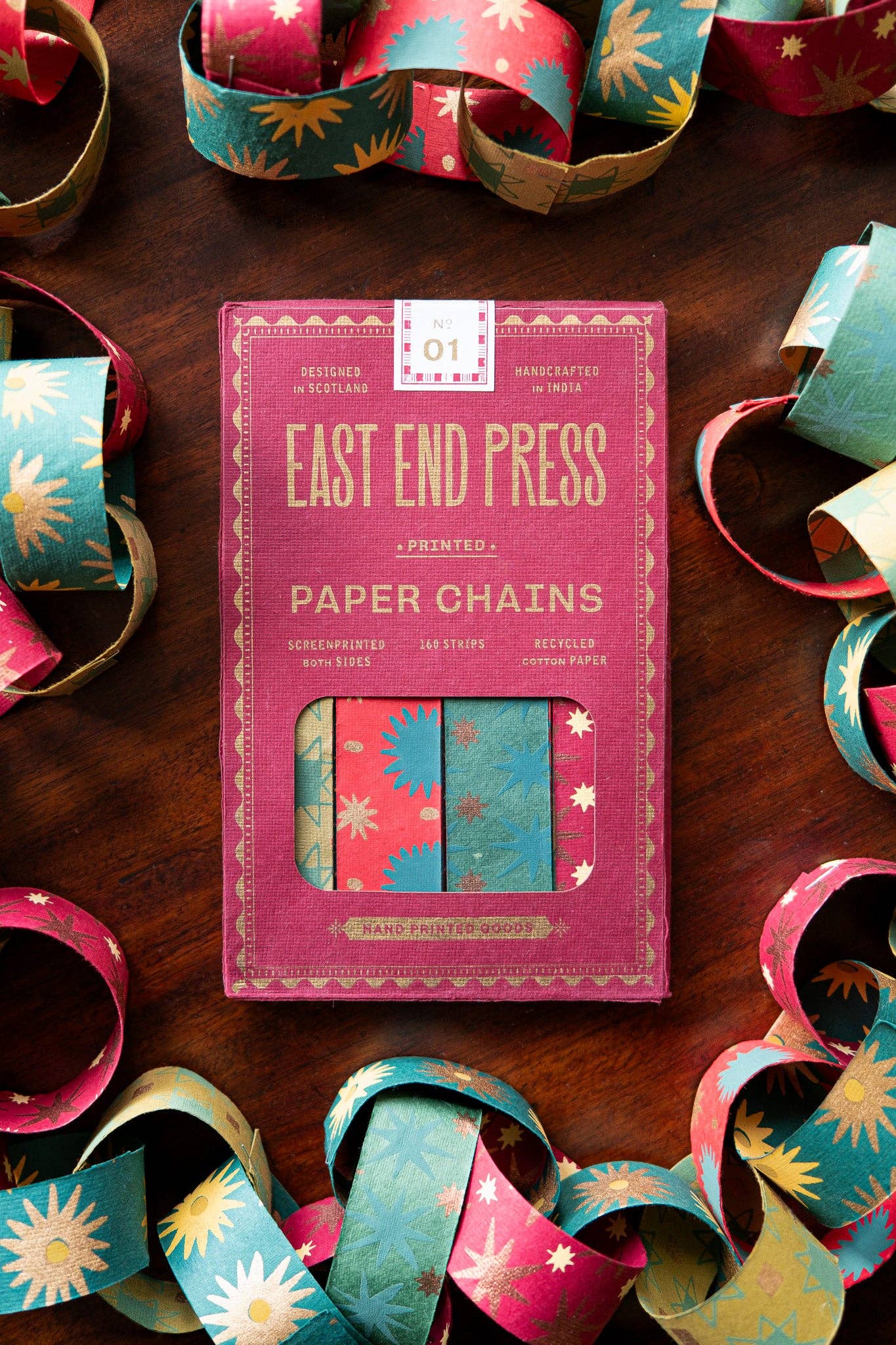 Recycled festive paper chain strips, hand-printed double-sided, eco-friendly decoration kit.
