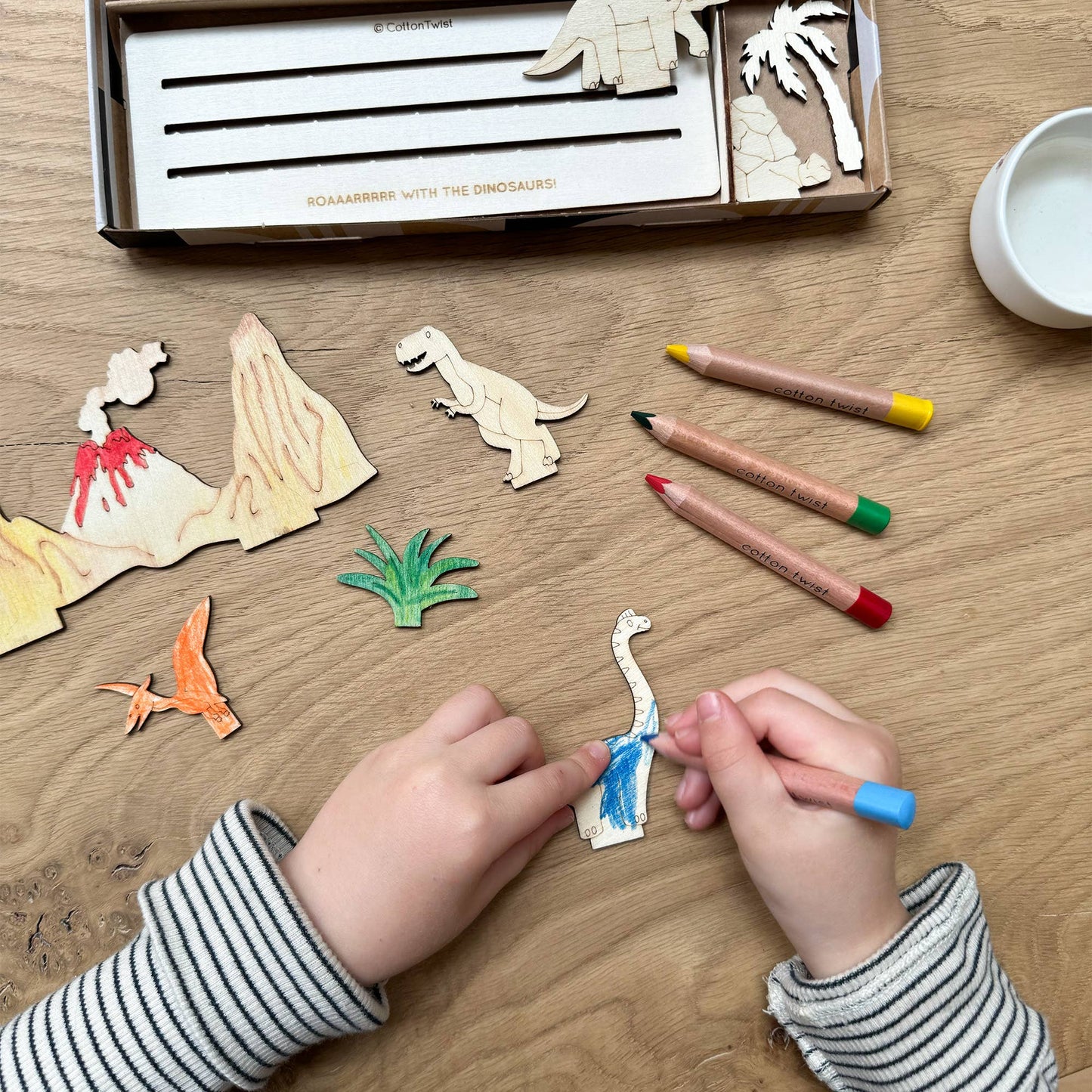 This craft kit is perfect for those who love to be creative, those who love dinosaurs (who doesn't!). Inside, discover a collection of wooden pieces, each intricately designed to spark creativity, including the mighty T-Rex, a triceratops, pterodactyl and a brachiosaurus. With wooden parts of all your favourite dinosaurs, plus scenery, the watercolour pencils & paintbrush included allow for detailed ; precise painting with the ability to mix colours. Once painted, simply add the wooden parts
